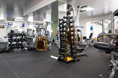 a gym with a bunch of equipment in it at Browns Sports Resort in Vilamoura
