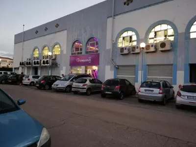 a group of cars parked in front of a building at Sea View urban apartment in Faro