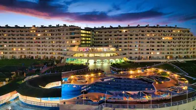 a large building with a courtyard in front of it at Hotel Apartamento Paraiso De Albufeira in Albufeira