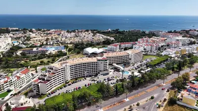 an aerial view of a city with the ocean at Hotel Apartamento Paraiso De Albufeira in Albufeira