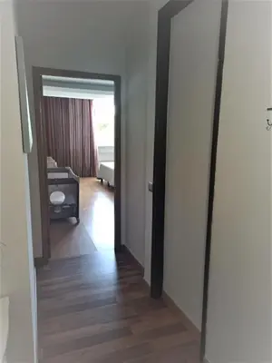 a hallway with a door leading to a living room at Parque das Amendoeiras in Vilamoura