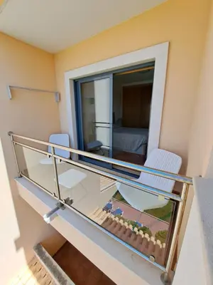 a hallway with a sink and a door with a fire extinguisher at Charming Ocean View Apartment in Albufeira