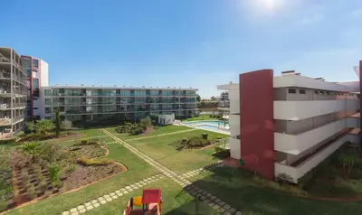 an aerial view of a building and a park at Residence Golf Club by Garvetur in Vilamoura