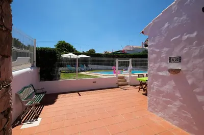 a patio with a view of a swimming pool at LOTUS VILLA, Albufeira in Albufeira