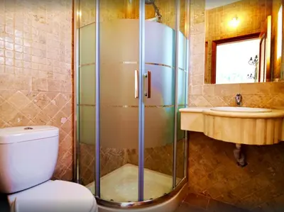 a bathroom with a shower and a toilet and a sink at Quinta Da Ilda in Loulé