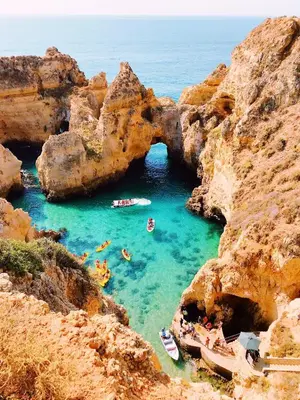 a group of people swimming in a cave in the water at Spacious apartment in Albufeira 80 m² with shared pool in Roja- Pé