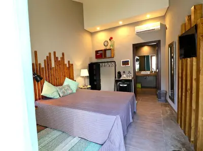 a bedroom with a large bed in a room at Lost & Found - Guesthouse & Suites in Albufeira