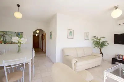 a living room with a couch and a table at Villa Amelia 156 - Clever Details in Vilamoura