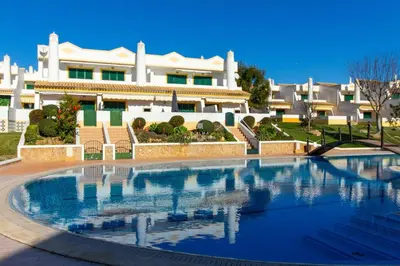 a large swimming pool in front of a building at São Rafael Beach Villa- D´alma Rafaella in Albufeira
