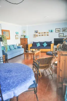 a blue bedroom with a bed and a bath tub at Beach House in Vilamoura: Terrace+pool in Vilamoura