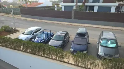a group of cars parked in a parking lot at Luxurious T2 apartment, Olhos Dagua in Albufeira