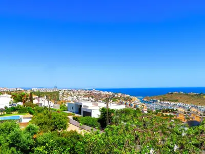 a view of a city with the ocean in the background at Villa Esmeralda in Albufeira