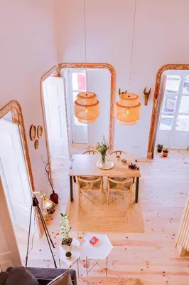 a room with a table and two mirrors at A Casa D'Amelie in Faro