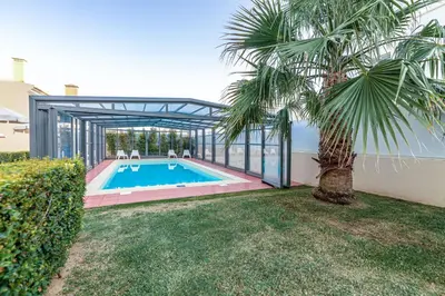 an image of a swimming pool in the backyard of a house at Boutique & Villas Boliqueime in Boliqueime