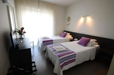 a swimming pool with chaise lounge chairs and a resort at Boutique & Villas Boliqueime in Boliqueime