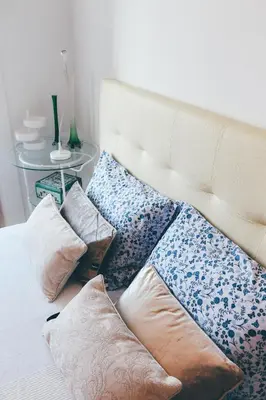 a bed with pillows on it in a room at Studio Sal in Albufeira