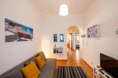 a living room with a couch and a tv at #003 Cottage By Home Holidays in Albufeira