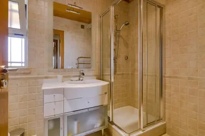 a bathroom with a sink and a shower at Avelãs - Modern apartment - Vilamoura in Vilamoura