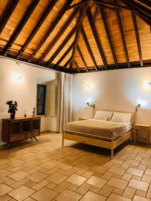 a bedroom with a bed and a window at Faro Town House in Faro