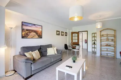 a living room with a couch and a table at Golden Rana Apartment in Albufeira