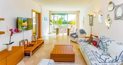 a living room with a couch and a table at Marina Vilamoura - Aquamar 003 By Vilamoura Sun in Vilamoura