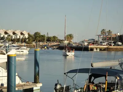 a boat is docked at a marina with other boats at Marina Vilamoura - Aquamar 003 By Vilamoura Sun in Vilamoura