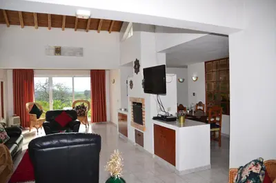 a living room with a couch and a tv at Villa Batista in Guia