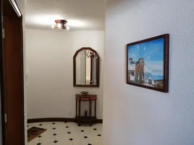 a living room with a couch and a tv at Albufeira INN - CORAL T1 in Albufeira
