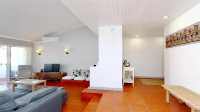 a living room with a couch and a table at Palmeiras do Golfe 160 - Clever Details in Vilamoura