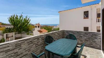 a table and chairs on the balcony of a house at ★ Sea View ★ 1 Minute to Oldtown and Beach ★ in Albufeira