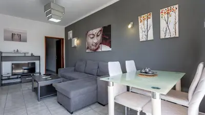 a living room with a couch and a table at ★ Sea View ★ 1 Minute to Oldtown and Beach ★ in Albufeira