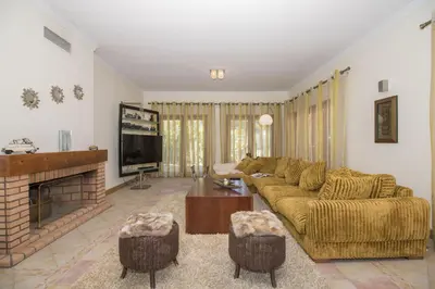 a living room with a couch and a table at Villa Valentina in Almancil