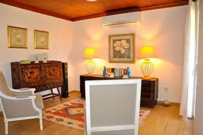 a dining room with a table and chairs at Fantastic for Family Gatherings, Optional Pool Heating, Free Air Con Wifi in Quarteira