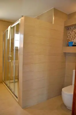a bathroom with a shower and a toilet at Fantastic for Family Gatherings, Optional Pool Heating, Free Air Con Wifi in Quarteira