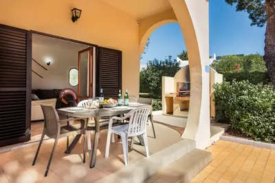 an overhead view of a swimming pool with lounge chairs and trees at Exclusive Retreat in Vilamoura, private pool, off-street parking, Free AC wifi in Quarteira