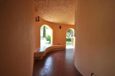 a patio with a table and chairs and an umbrella at 5 En-Suite Bedrooms, close to centre, free AC WiFi in Loulé