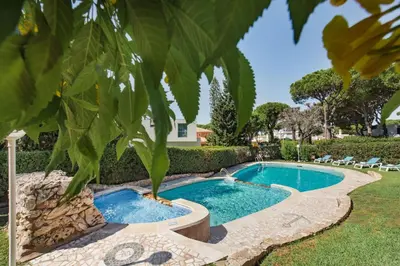 a bedroom with a large bed and a window at 5 En-Suite Bedrooms, close to centre, free AC WiFi in Loulé