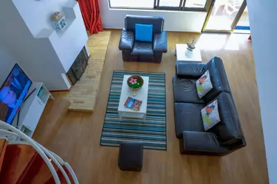 an overhead view of a living room with a couch and chairs at Casa Moura Golfe in Vilamoura