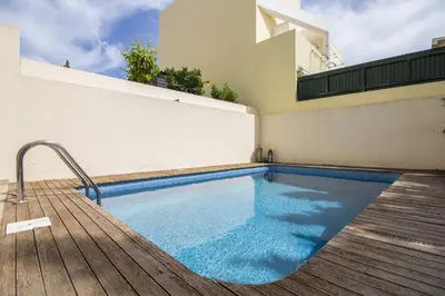 an overhead view of a swimming pool next to a building at Casa Oliveira in Loulé