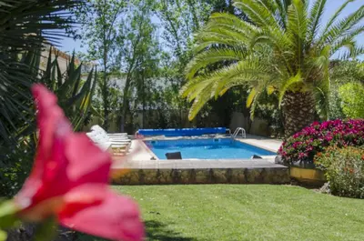 a white house with a white tower on top of it at Villa Caravela in Almancil
