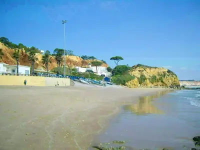 a view of a beach with houses and the ocean at Charming Apartment in Albufeira with Shared Pool in Albufeira