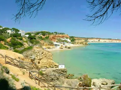 a view of a beach with the ocean and houses at Charming Apartment in Albufeira with Shared Pool in Albufeira