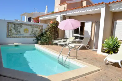 a bathroom with a toilet and a sink and a shower at Stylish well-equipped, private pool, close to amenities, free AC Wifi in Quarteira