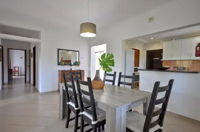 a yard with trees and grass and a house at Delightful single-storey villa, private pool, free air conditioning and wifi in Vilamoura