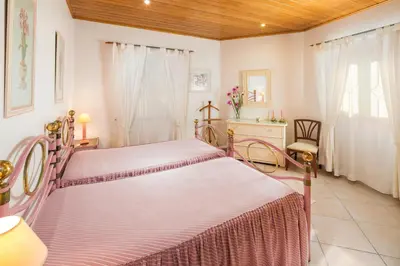 a bedroom with two beds in a room at Casa da Vila in Albufeira