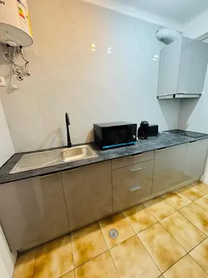a kitchen with a sink and a microwave at Apartment Old Town Telheiros in Albufeira