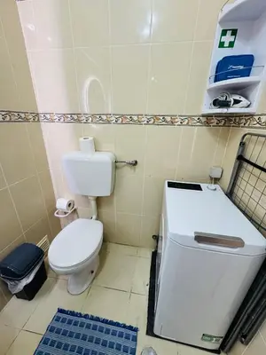 a small bathroom with a toilet and a sink at Apartment Old Town Telheiros in Albufeira