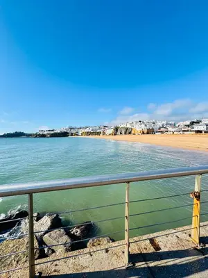 a view of a beach with a fence and the ocean at Apartment Old Town Ferreira de Castro in Albufeira