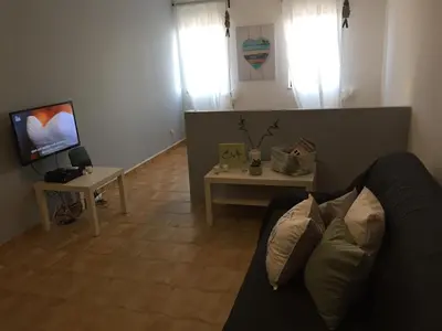 a living room with a couch and a table at Apartment Sea View 20m to beach - TOP Quarteira ALGARVE in Quarteira