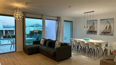 a living room with a couch and a table at Albuhera - Private Pool - 8 Pax - Albufeira in Albufeira